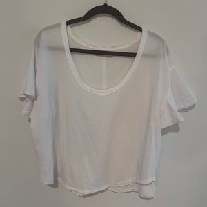 Free People White flowy tee shirt size M.